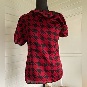 Red and black asymmetrical cowl neck puff sleeve blouse (very McQueen)